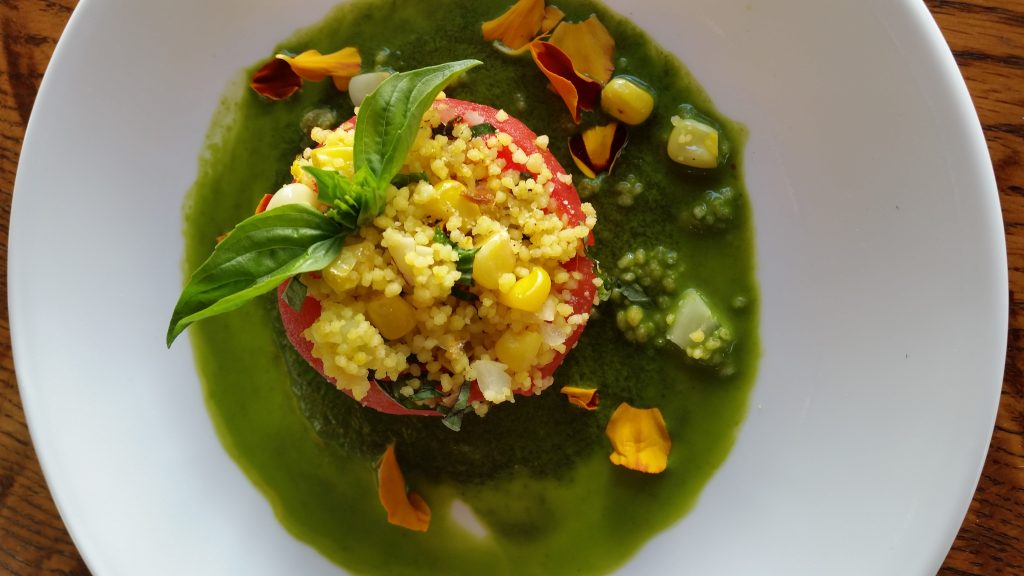 Stuffed Heirloom Tomatoes with Cous Cous, Corn, Almonds, Basil, and Cilantro Puree